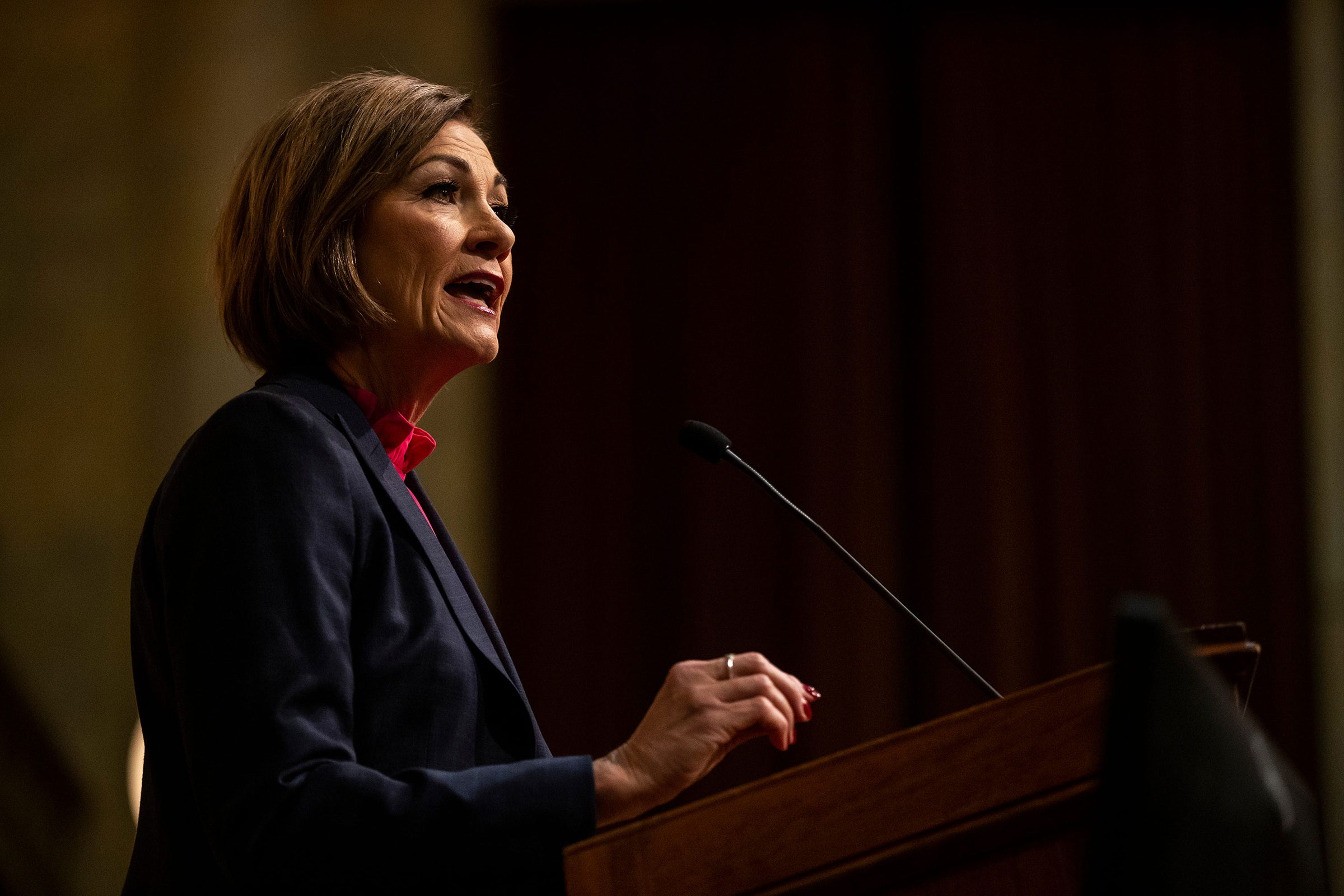 Governor Kim Reynolds gives the condition of the state address to members of the Iowa Legislature inside the House Chamber, on