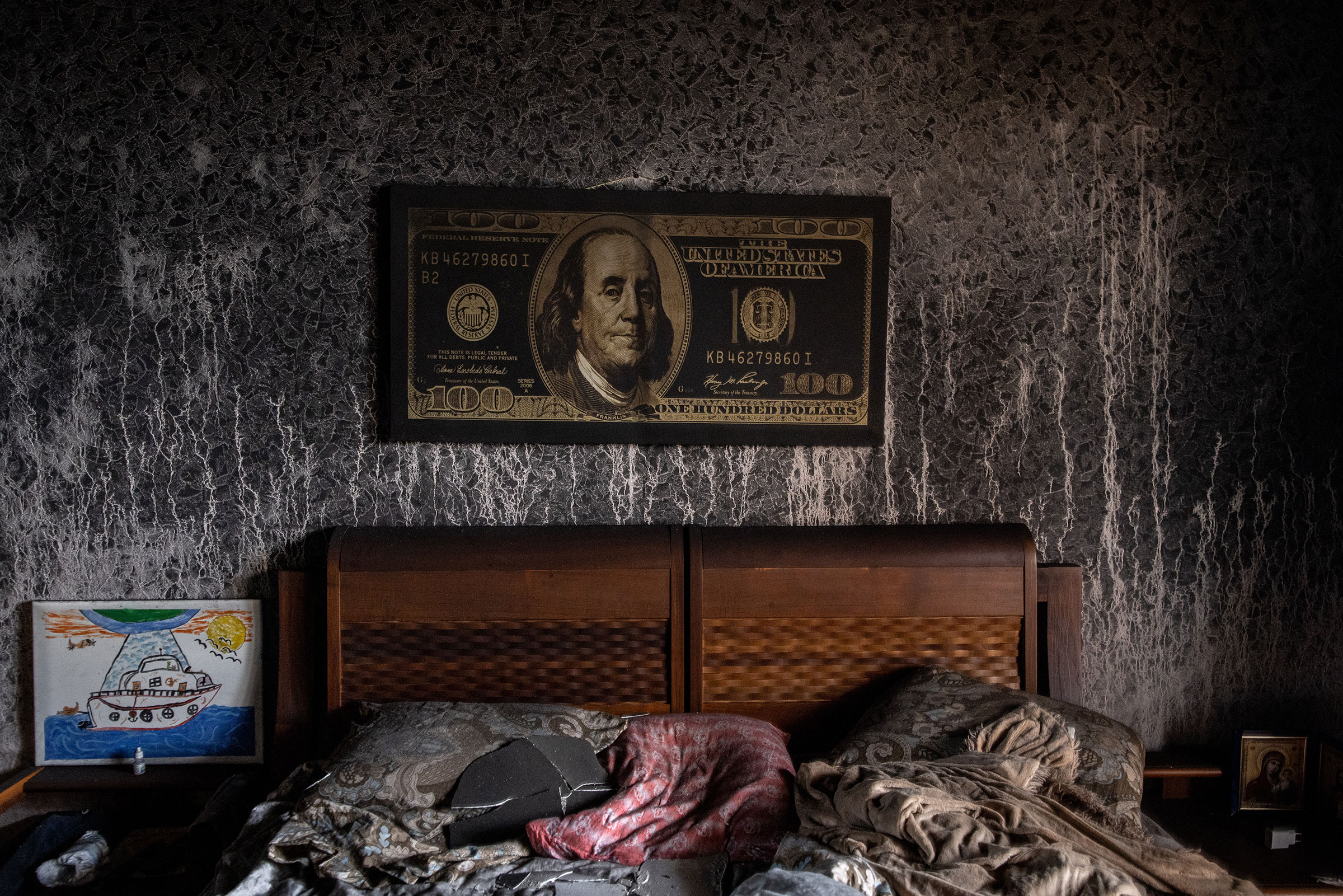 A burnt, damaged bedroom of an apartment is seen in a residential block hit by an early morning missile strike in Kyiv on Feb. 25. (Chris McGrath—Getty Images)