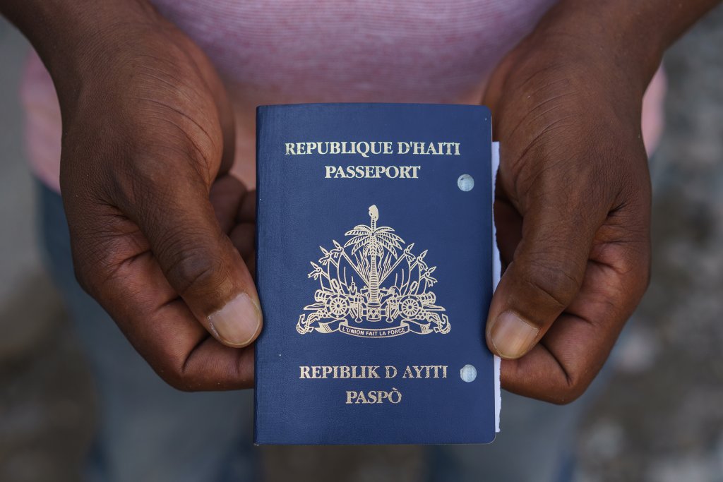Mirard Joseph shows his expired passport in Port-au-Prince, Haiti on Saturday, January 23, 2022.