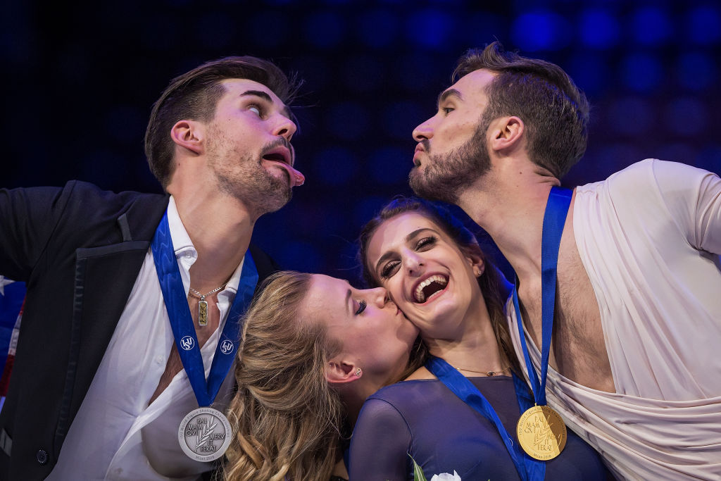Madison Hubbell and Zachary Donohue of the United States, Gabriella Papadakis and Guillaume Cizeron of France pose in the Ice Dance medal ceremony during day four of the World Figure Skating Championships at Mediolanum Forum on March 24, 2018 in Milan, Italy. (Joosep Martinson—International Skating Union via Getty Images)