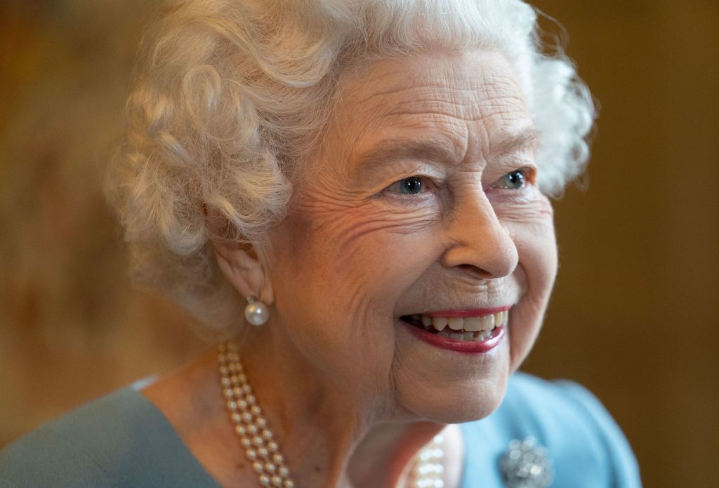 Queen Elizabeth II smiles during a reception in the Ballroom of Sandringham House, the Queen's Norfolk residence on Feb. 5, 2022, as she celebrates the start of the Platinum Jubilee. (Joe Giddens—Pool/AFP/Getty Images)