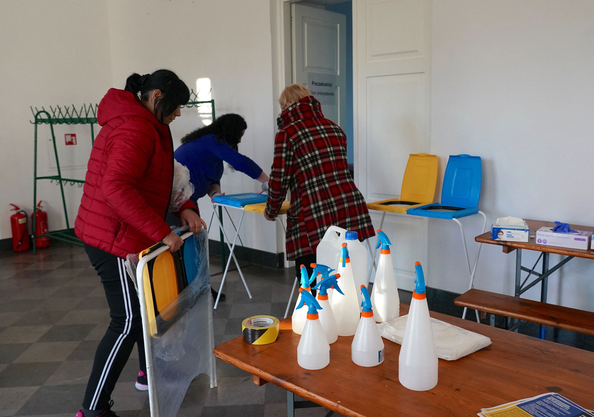 Staff make preparations at a reception centre for Ukrainian refugees in Dorohusk, Poland after Russian President Vladimir Putin authorized a military operation in Ukraine, on Feb. 24.