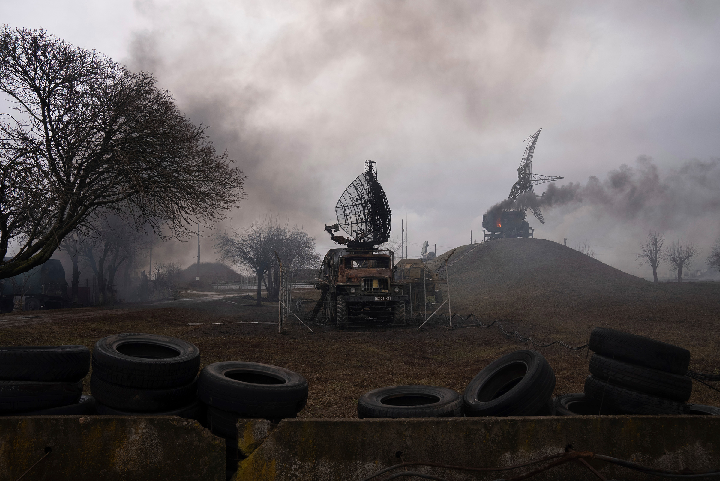 Smoke rises from an air defense base in the aftermath of a Russian strike in Mariupol, Ukraine on Feb. 24.