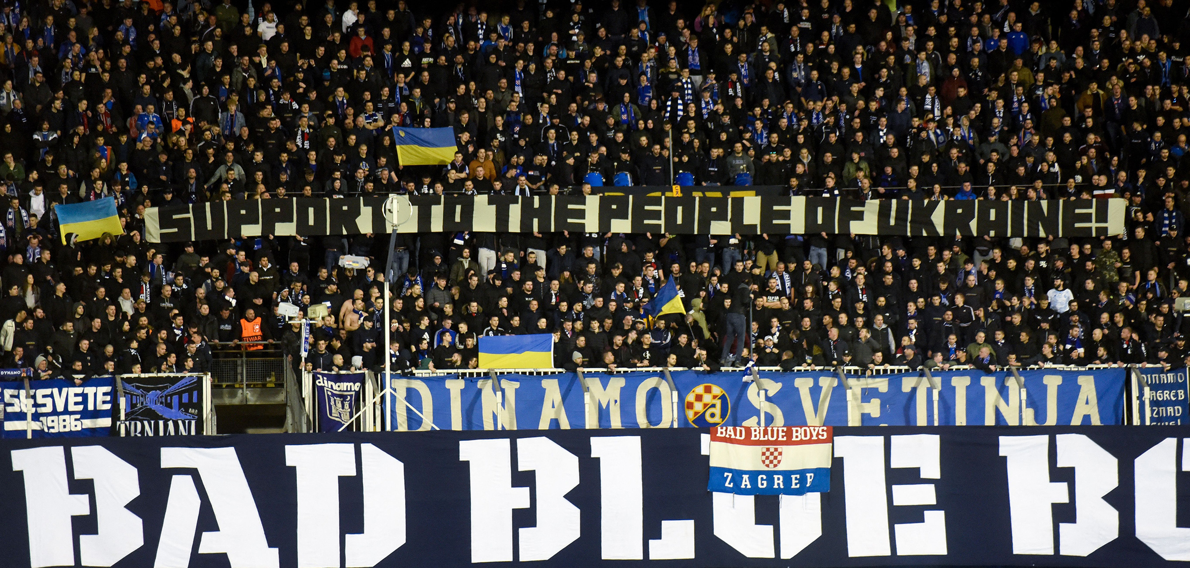 Dinamo Zagreb supporters hold a banner in support of the people of Ukraine during the UEFA Europa League football second leg match between Dinamo Zagreb and Sevilla FC at the Maksimir stadium in Zagreb, Croatia, on Feb. 24 (Denis Lovrovic—AFP/Getty Images)