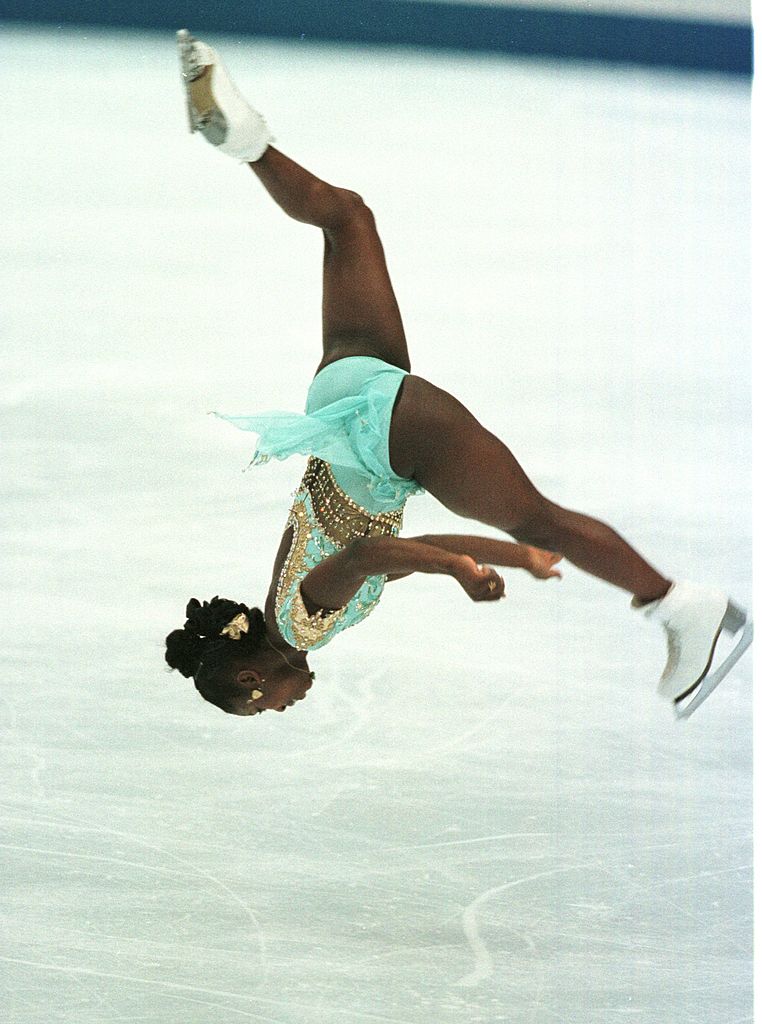 France's Surya Bonaly does a back flip during the women's long program at the White Ring at the 1998 Winter Olympics in Nagano. (John Tlumacki—The Boston Globe via Getty Images)