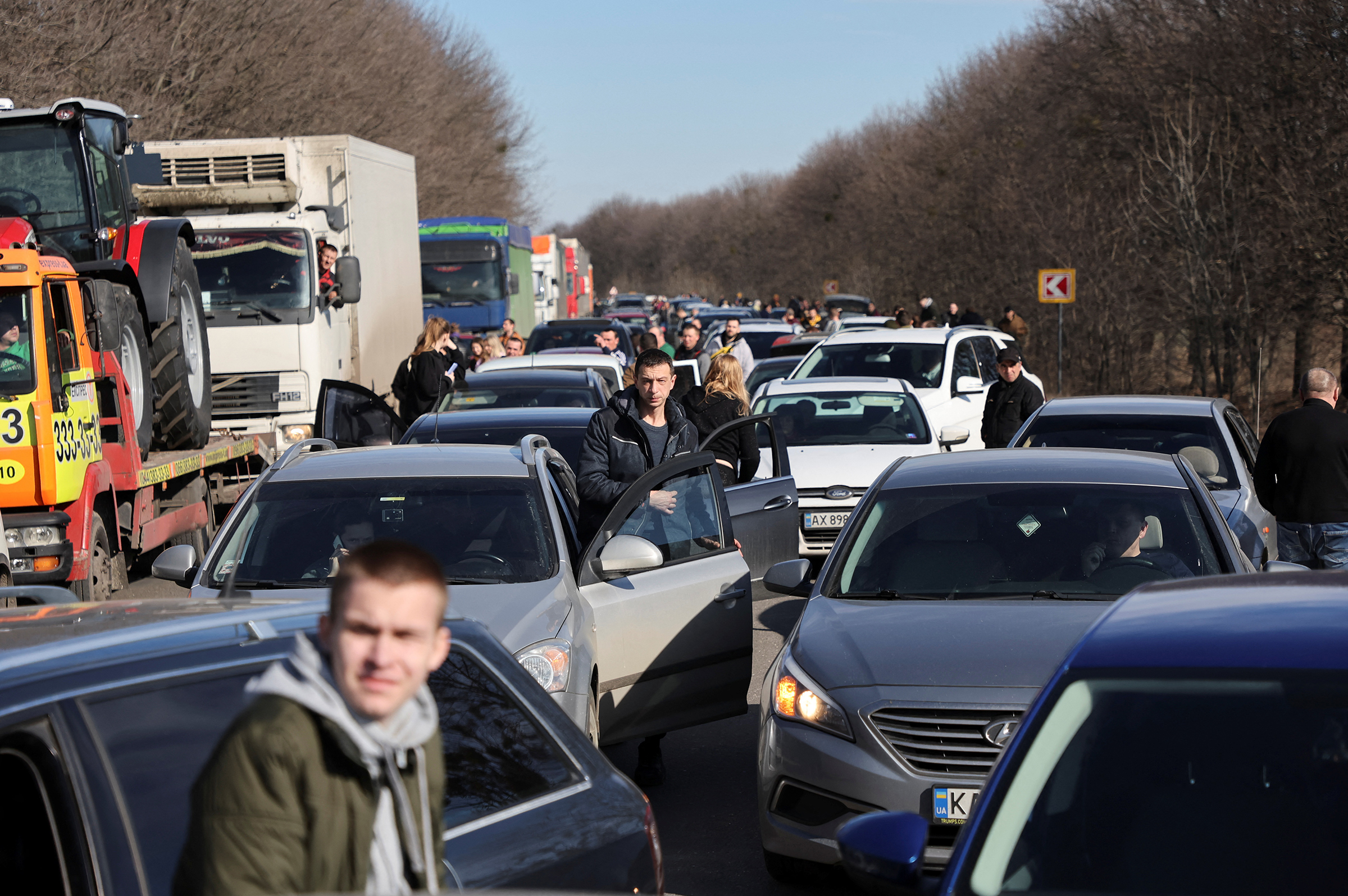 People wait in a traffic jam as they leave the city of Kharkiv, Ukraine, after Russian President Vladimir Putin authorised a military operation in eastern Ukraine, Feb. 24 (Antonio Bronic—Reuters)