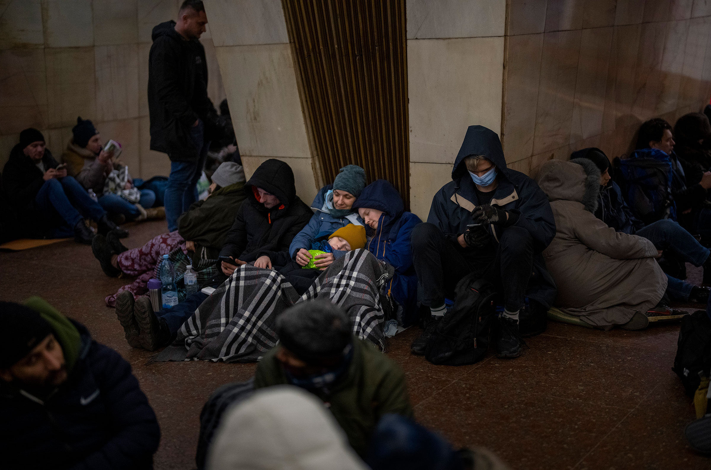 People rest in the Kyiv subway, using it as a bomb shelter in Kyiv, Ukraine, on Feb. 24, 2022. (Emilio Morenatti—AP)
