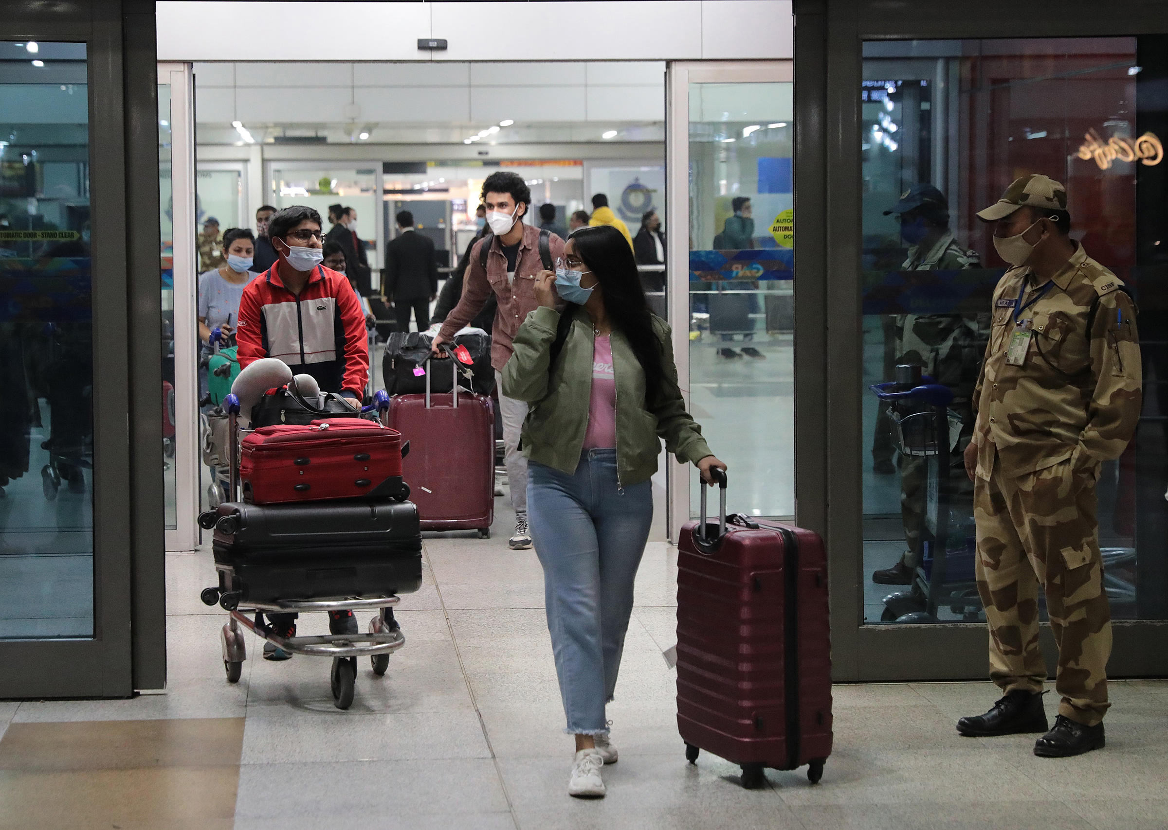 Indian students returning from Ukraine are received by their relatives amid the crisis, at Indira Gandhi International airport in New Delhi, Feb. 22 (Rajat Gupta—EPA-EFE/Shutterstock)