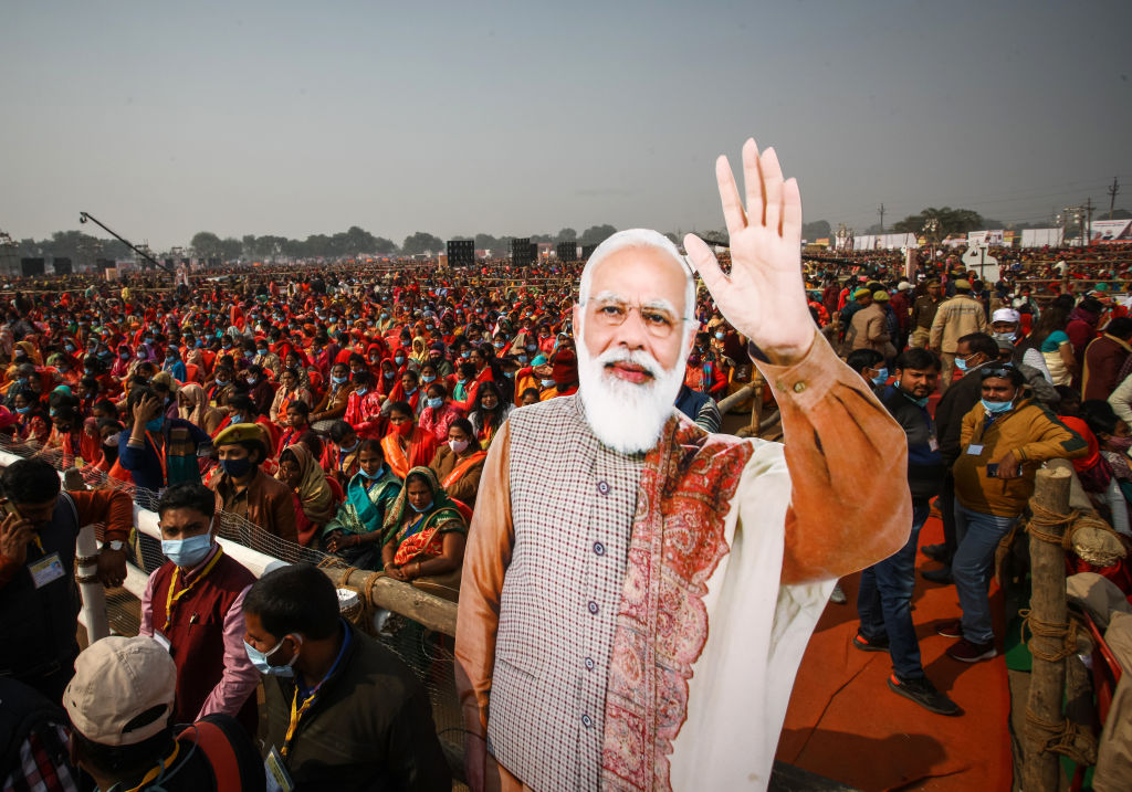 Women from various districts are seen near cut-outs of India's Prime Minister Narendra Modi at a rally held by Modi on December 21, 2021 in Allahabad, India. (Ritesh Shukla—Getty Images)