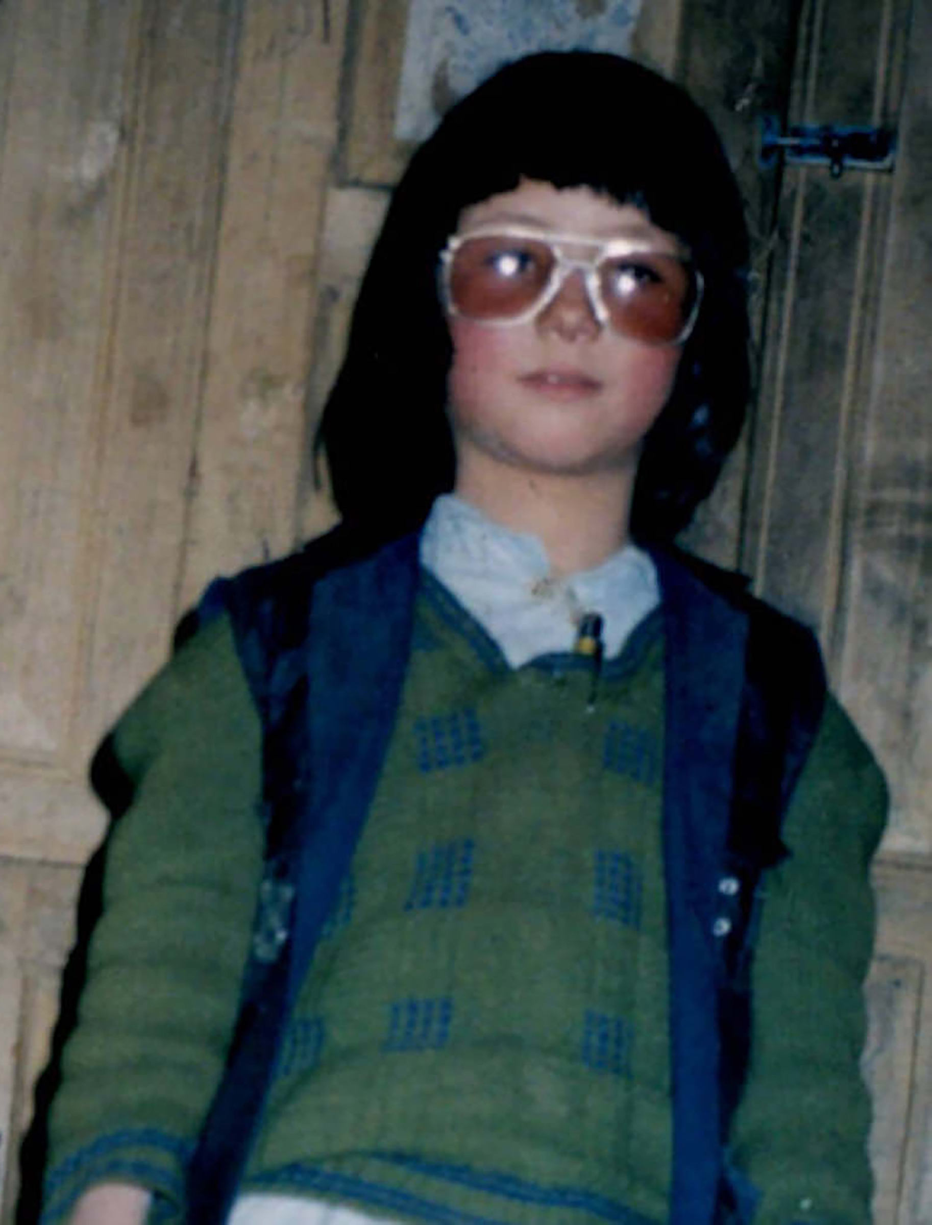 Joya, dressed as a boy to go to school at age 8 (Courtesy Zahra Joya)