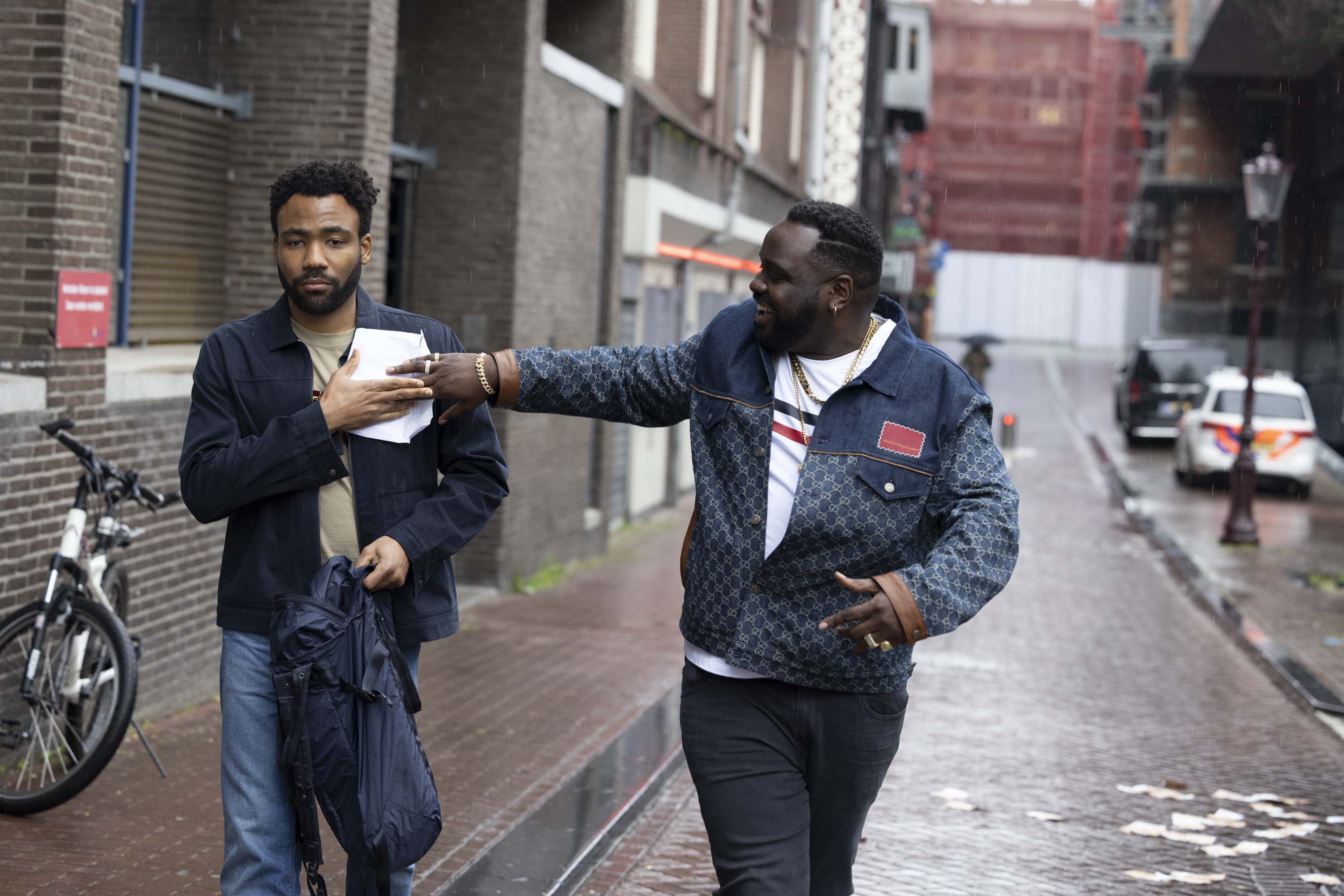 “ATLANTA” --  "Sinterklaas is Coming to Town" -- Season 3, Episode 2 (Airs March 24) Pictured (L-R): Donald Glover as Earn Marks, Brian Tyree Henry as Alfred "Paper Boi" Miles.  CR: Coco Olakunle/FX (Copyright 2022, FX Networks. All Rights Reserved.)