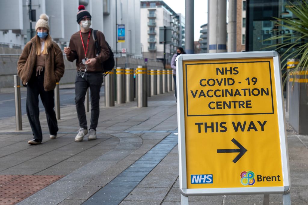 People walk past a COVID-19 vaccination center in London on Jan. 28, 2022. (Ray Tang/Xinhua News Agency—Getty Images)