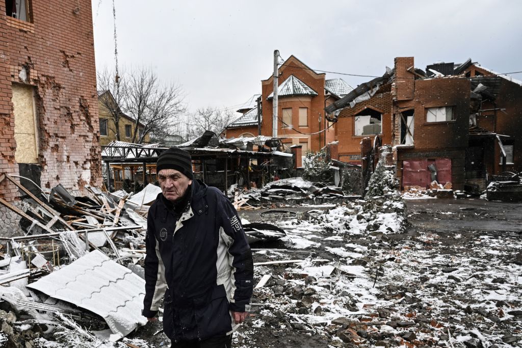 A man walks between houses destroyed during air strikes on the central Ukranian city of Bila Tserkva on March 8, 2022. - Russia stepped up its bombing campaign and missile strikes on Ukraine's cities, destroying two residential buildings in a town west of Kyiv with the city of Bila Tserkva to the south of the capital also hit. (Aris Messinis-AFP)