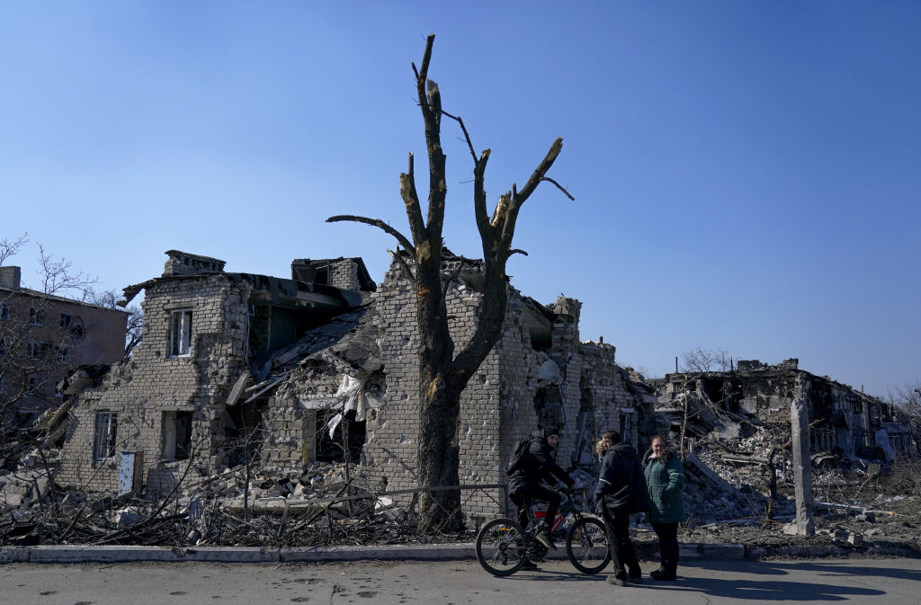 Destroyed buildings are seen as civilians are evacuated along humanitarian corridors from the Ukrainian city of Mariupol under the control of Russian military and pro-Russian separatists, on March 21, 2022. (Stringer-Anadolu Agency)