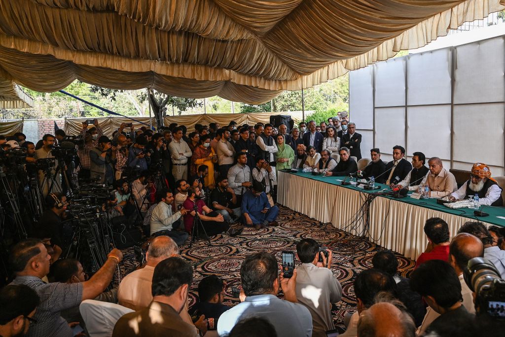 Pakistan's opposition leaders Fazlur Rehman (R), Shahbaz Sharif (2R), and Bilawal Bhutto Zardari (4R) along with a government coalition partner and leader of Muttahida Qaumi Movement (MQM-P), Khalid Maqbool Siddiqui (3R) speak during a press conference in Islamabad on March 30, 2022. (AAMIR QURESHI/AFP via Getty Images)