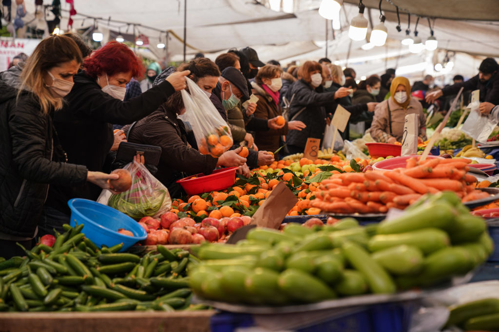 People shop for fruit and vegetables at a street market on Jan. 8 2022, Istanbul, Turkey. (Cemal Yurttas/Dia images via Getty Images)
