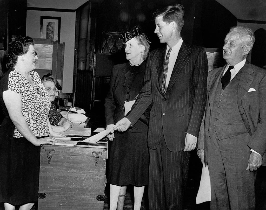 John F. Kennedy votes in the 1946 Massachusetts democratic primary election in which he ran for congressman. With him are maternal grandparents Mr. and Mrs. John F. Fitzgerald (Honey Fitz). (Photo by © CORBIS/Corbis via Getty Images) (Corbis-Getty Images)