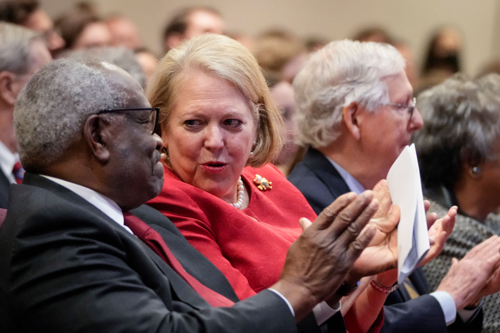 Associate Supreme Court Justice Clarence Thomas sits with his wife and conservative activist Virginia Thomas while he waits to speak at the Heritage Foundation in Washington, DC.,  on October 21, 2021. (Photo by Drew Angerer—Getty Images)