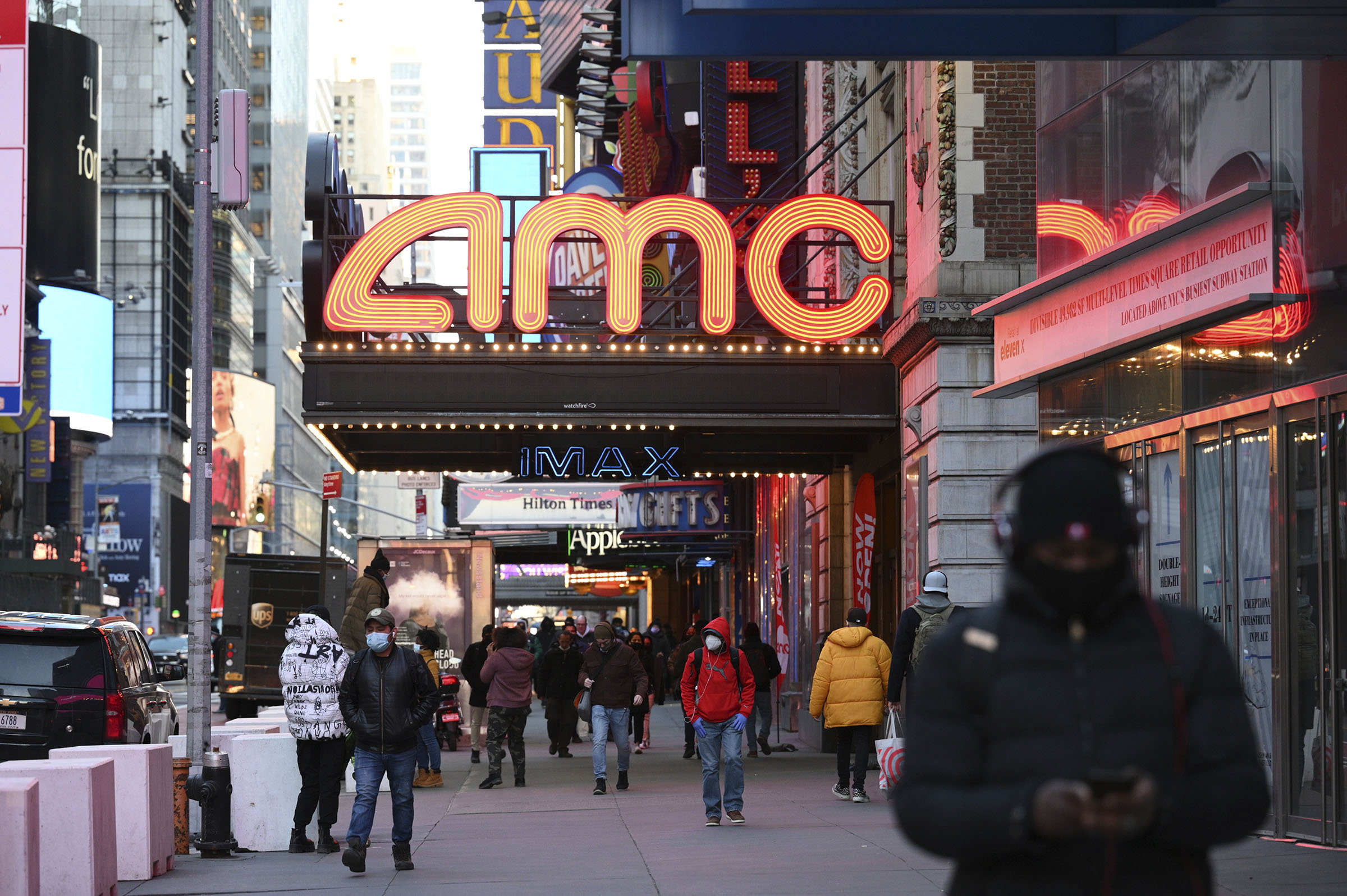 he AMC Empire 25 theater reopens after COVID-19 closures, Friday, March 5, 2021, in New York. Movie theater chain AMC is selling 8.5 million shares to investment firm Mudrick Capital Management, raising $230.5 million and cashing in on the meme stock frenzy that has helped boost its stock price in recent months. (Evan Agostini—Invision/AP)