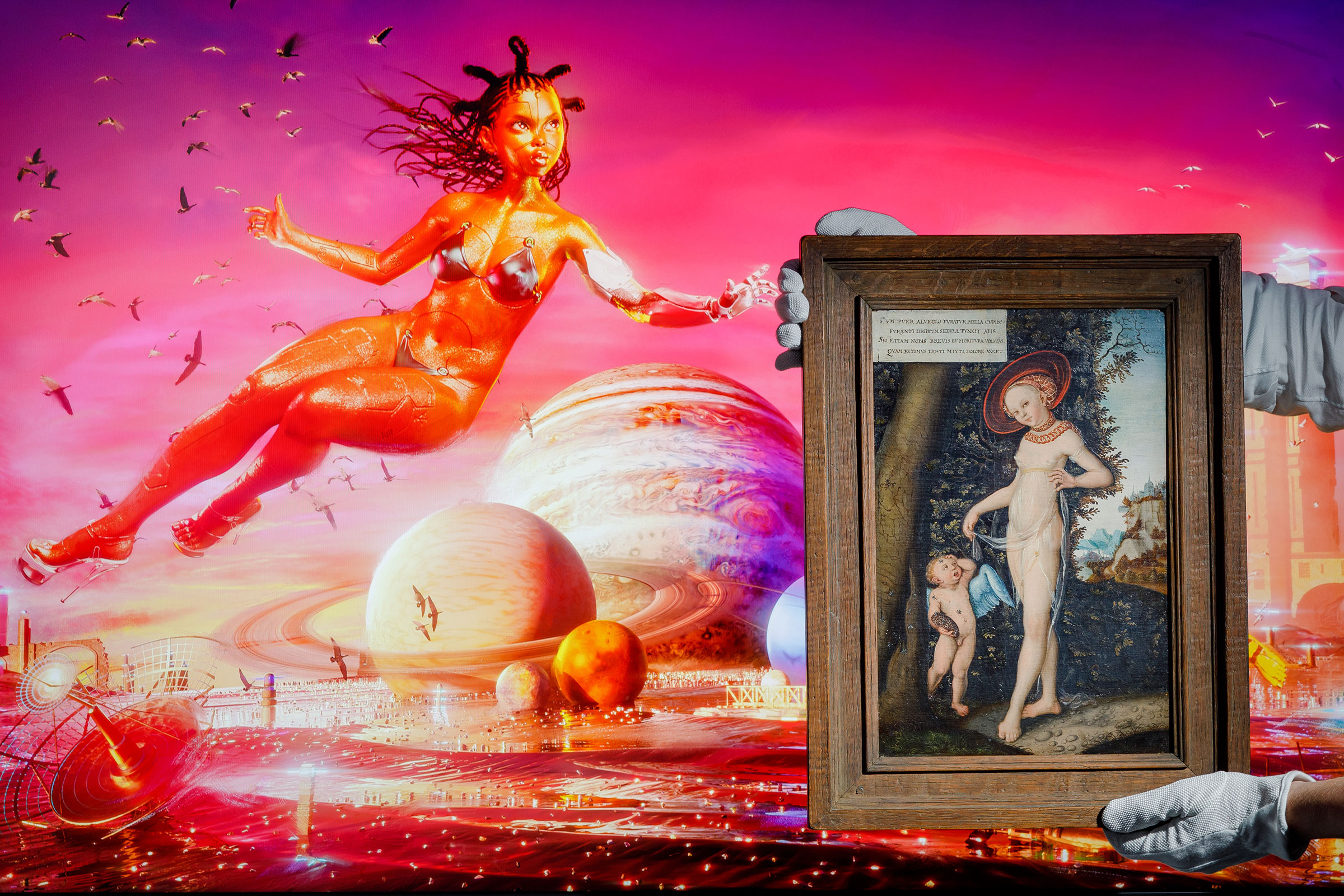 Serwah Attafuah’s [em]Creation of My Metaverse (Between this World and the Next)[/em] alongside [em]Venus with Cupid stealing honey, by a follower of Lucas Cranach the Elder,[/em] early 17th Century at Sotheby's on June 4, 2021 in London. (Tristan Fewings—Sotheby's/Getty Images)