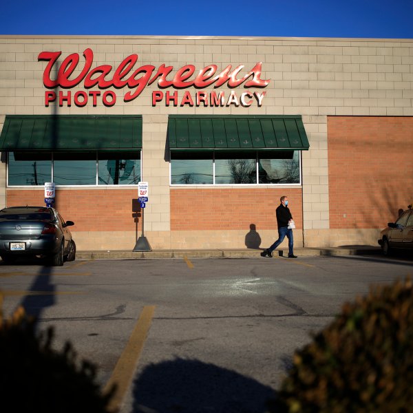 A shopper exits from a Walgreens store in Louisville, Kentucky, U.S., on Monday, Jan. 4, 2021.