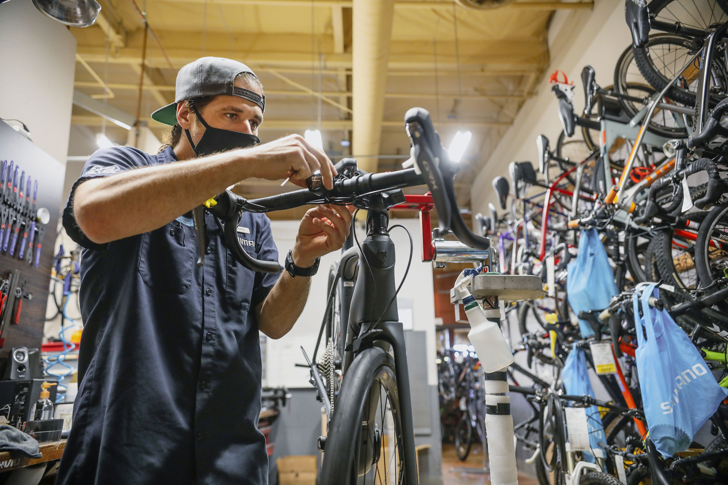 A mechanic assembles a bike at the Trek Bicycle Shop in San Diego, California, U.S., on Friday, May 15, 2020. (Sandy Huffaker—Bloomberg)