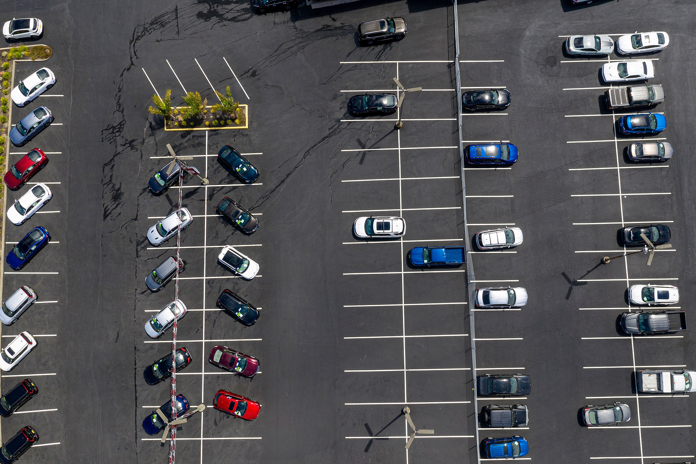 Vehicles in a nearly empty lot at a car dealership in Richmond, Calif., on July 1, 2021. (David Paul Morris—Bloomberg/Getty Images)