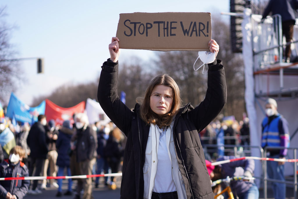 Climate activist Luisa Neubauer holds a sign "Stop the war!" in front of a demonstration under the slogan "Stop the war! Peace for Ukraine and all of Europe" in Berlin, Germany on Feb. 27, 2022. (Jörg Carstensen/picture alliance—Getty Images)