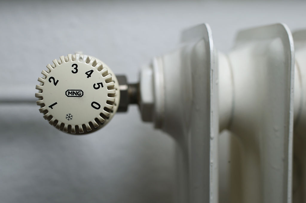 An older-model thermostat is seen attached to a heating radiator in an apartment on February 18, 2016 in Berlin, Germany. (Sean Gallup—Getty Images)