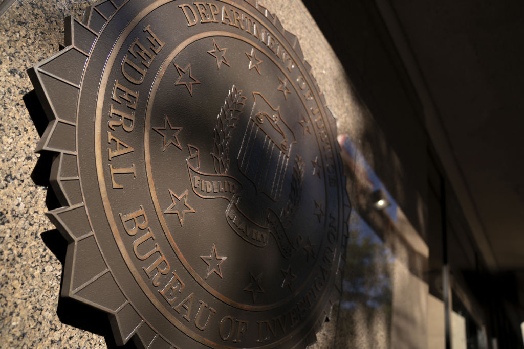 The Federal Bureau of Investigation (FBI) seal outside the headquarters in Washington, D.C., photographed in 2020. Academics and other experts who track the rising and falling of crime in America were expecting on Monday to see a fresh batch of data from the FBI: quarterly crime stats (courtesy of police departments) that would offer a picture of crime trends across the country in 2021. Instead, the agency announced that it would not be releasing the statistics, due to a lack of data provided by local police departments. (Stefani Reynolds—Bloomberg via Getty Images)