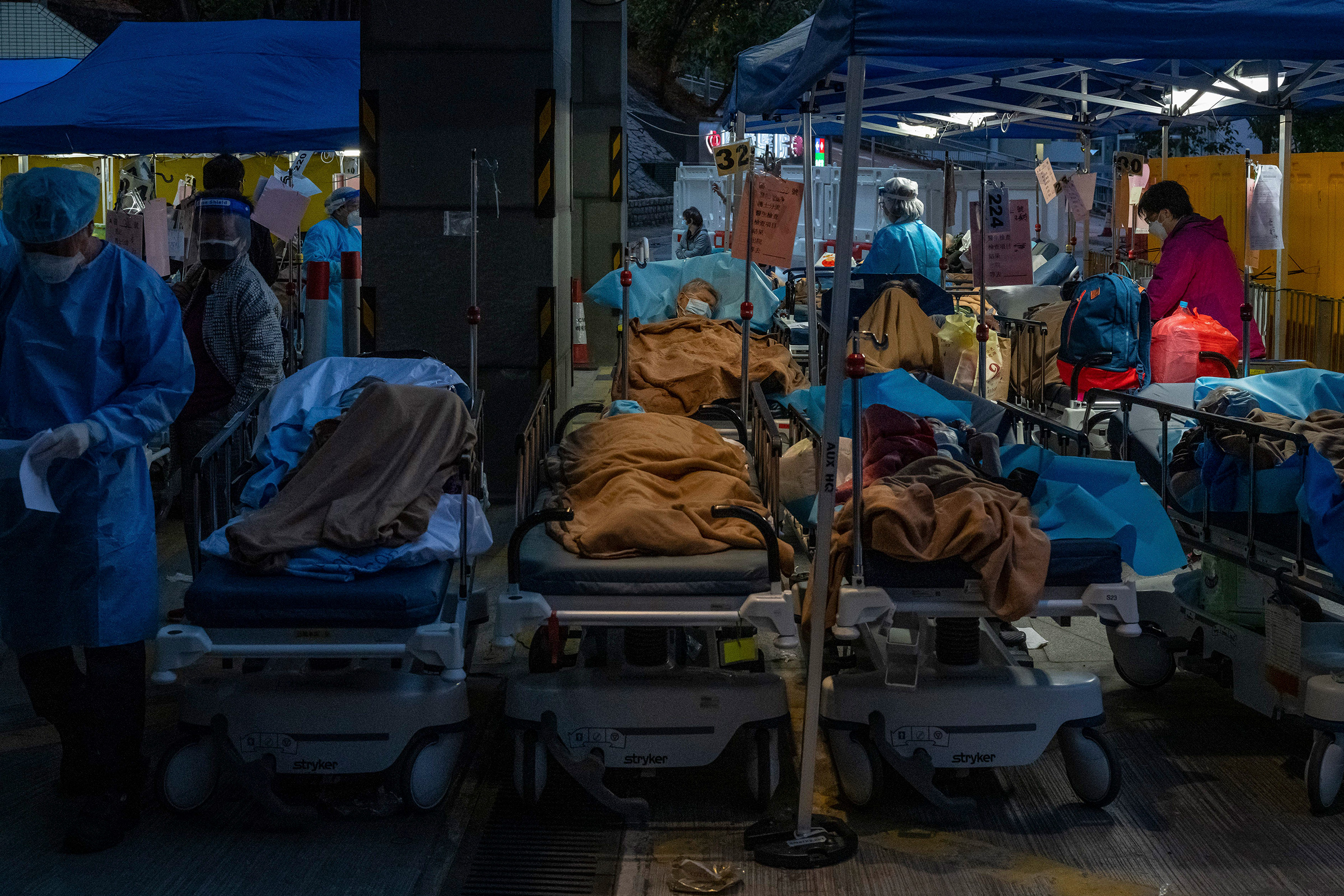 Patients are treated at a makeshift area outside Caritas Medical Center in Hong Kong, March 2 (Billy H.C. Kwok—The New York Times/Redux)
