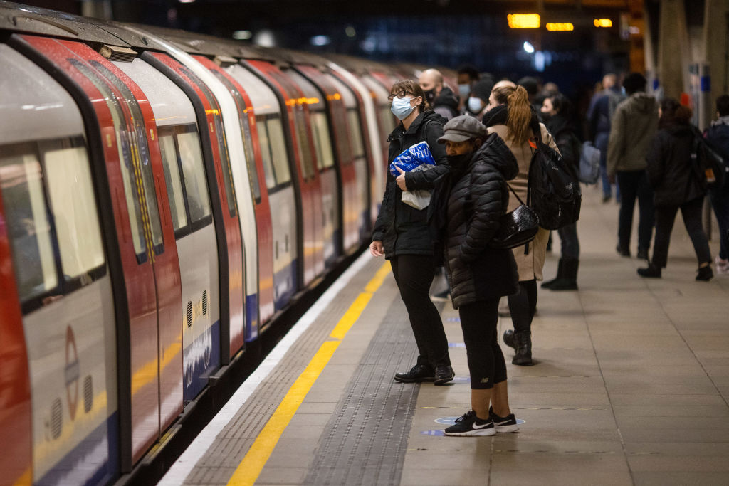 Commuters wait on the Jubilee line platform at Canning Town Station in London, U.K., on Wednesday, Jan. 20, 2021. (Simon Dawson/Bloomberg— Getty Images)