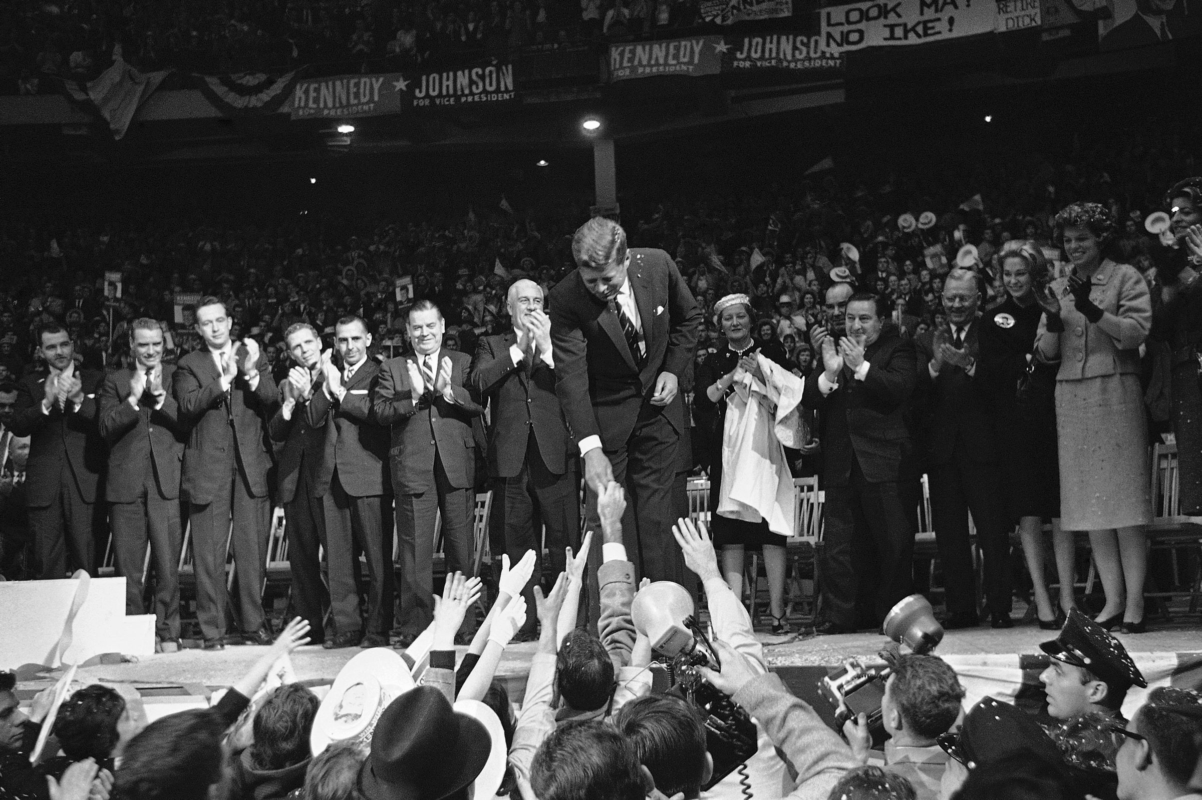 Senator John F. Kennedy responds to roaring throng in his final bid for Presidency in Boston Garden, Nov. 7, 1960 in Boston. (AP)