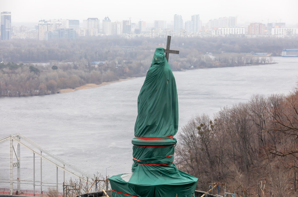 In this March 26, 2022, photo, a monument of Volodymyr the Great is surrounded by a a special protective structure on Volodymyrsky Hill in Kyiv to safeguard it from possible bombardment as Russian forces continue their full-scale invasion of Ukraine. (Mykhaylo Palinchak/SOPA Images/LightRocket—Getty Images)