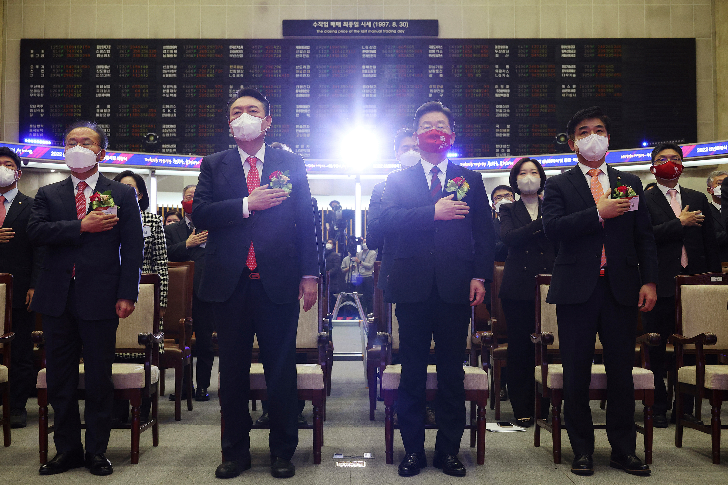 Yoon, center left, and Lee, center right, attend a ceremony for the first trading day of stock market at the Korea Exchange in Seoul on Jan. 3 (Kim Hong-ji—Pool/AP)