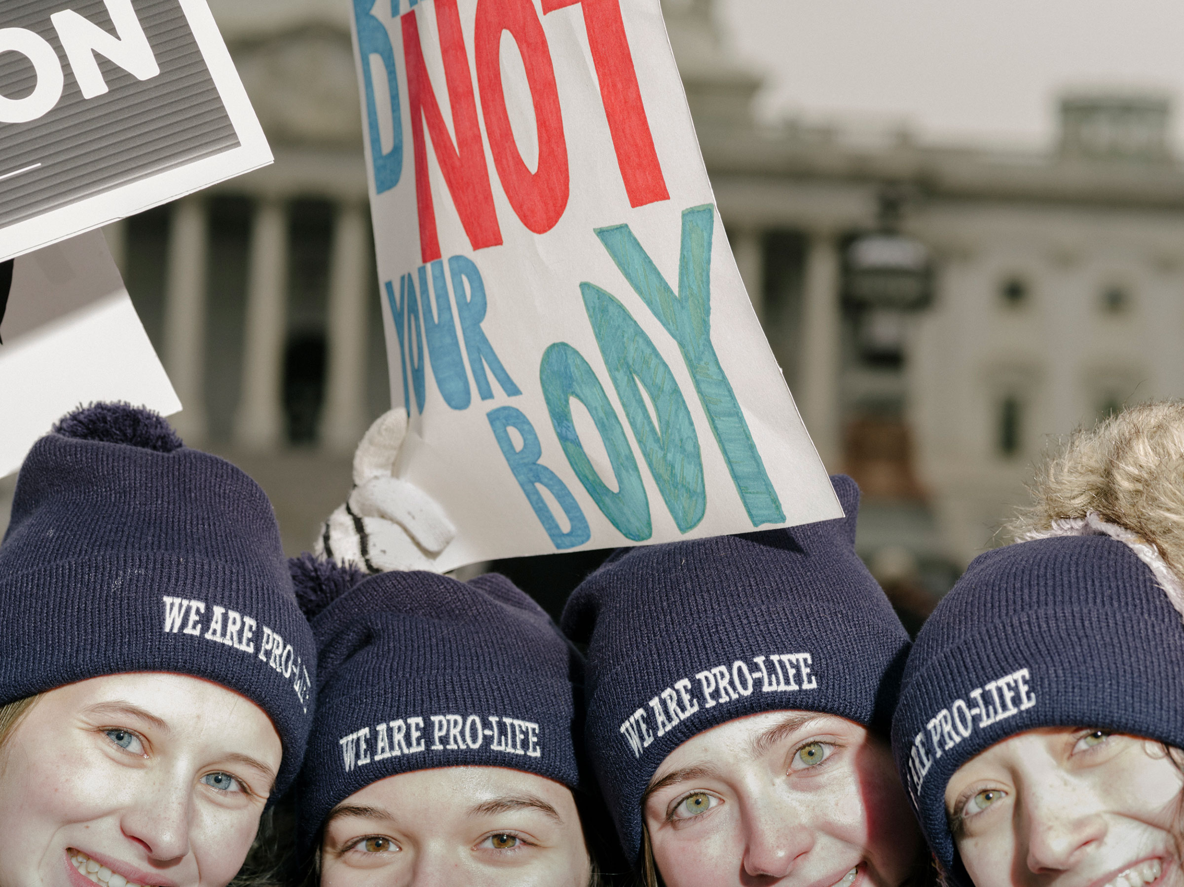 Attendees of the March for Life, held the day before the anniversary of the Supreme Court ruling of Roe v. Wade, stand in front of the Supreme Court building in Washington, on Jan. 21, 2022. (M. Levy for TIME)