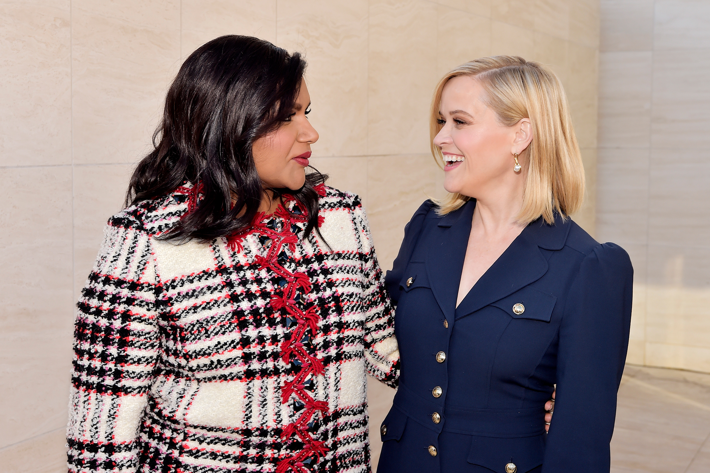 Mindy Kaling and Reese Witherspoon attend the Hollywood Reporter's Dec. 2019 Power 100 Women in Entertainment event in Los Angeles. (Stefanie Keenan—Getty Images for The Hollywood Reporter)