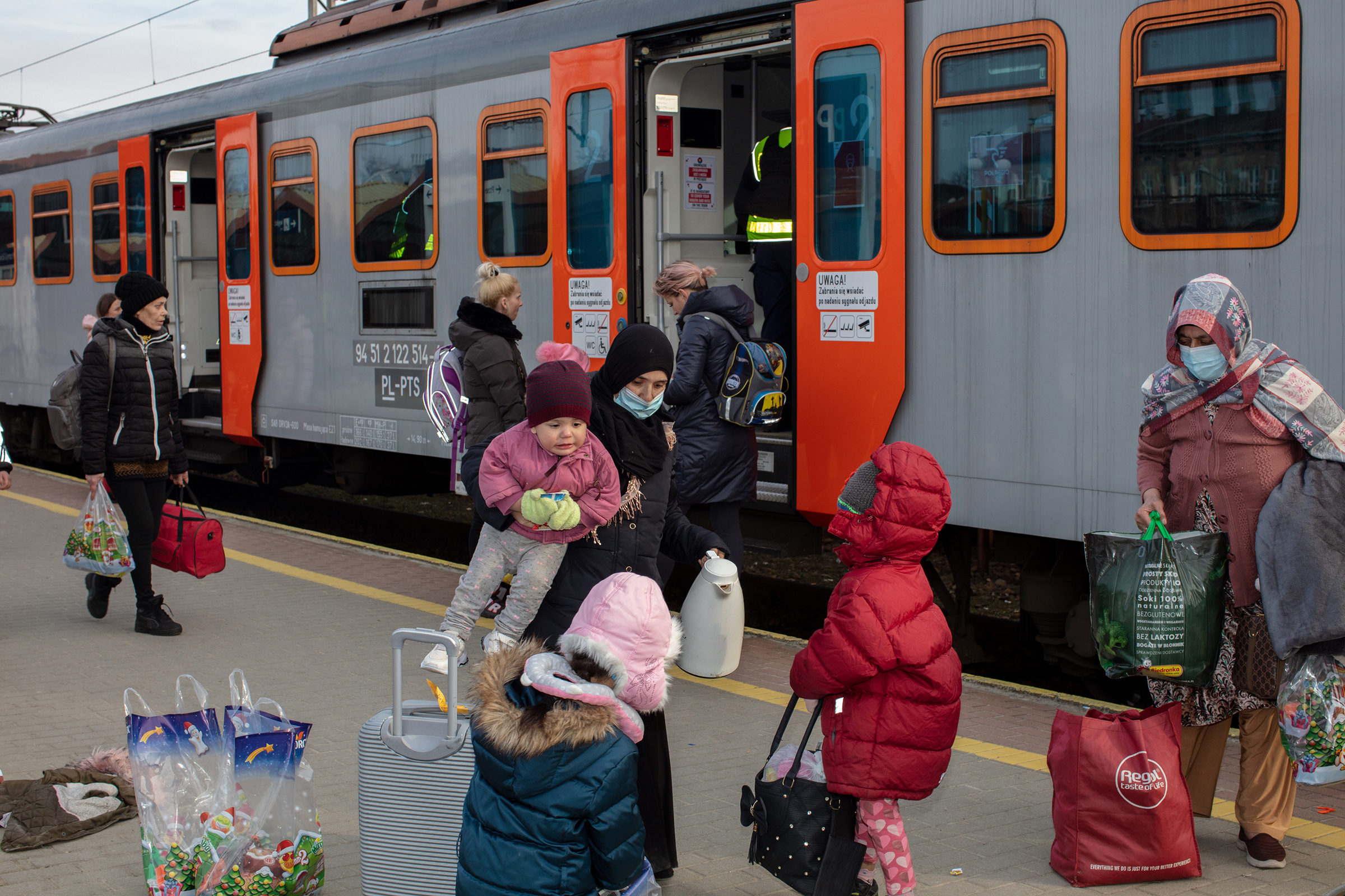 Refugees await transportation on the train platform in Przemysl, Poland, on March 1. (Natalie Keyssar for TIME)