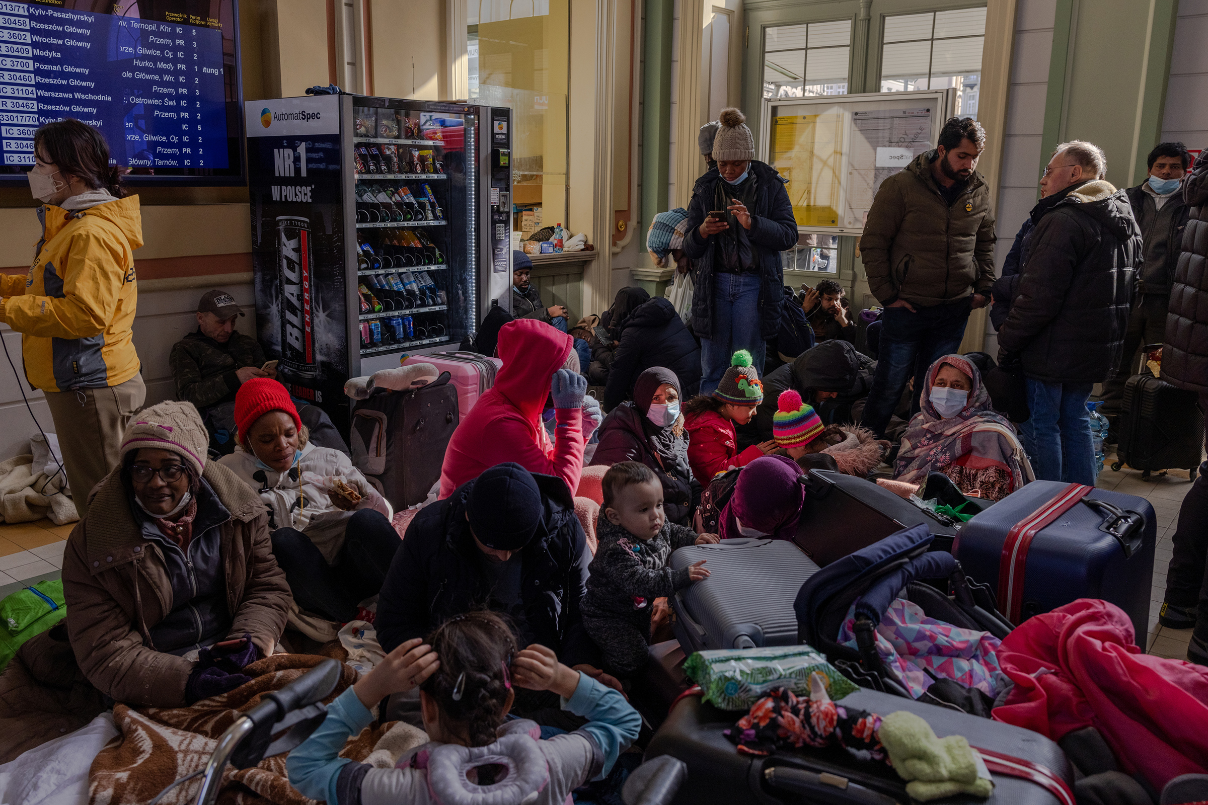 Refugees at the Przemysl train station await transportation on March 1. (Natalie Keyssar for TIME)
