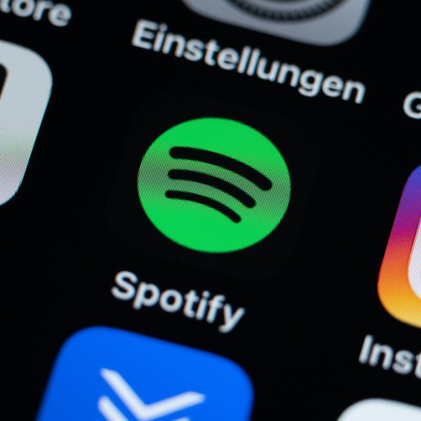 07 December 2021, Baden-Wuerttemberg, Villingen-Schwenningen: The application app Spotify can be seen on the display of an iPhone SE. Photo: Silas Stein/dpa (Photo by Silas Stein/picture alliance via Getty Images)
