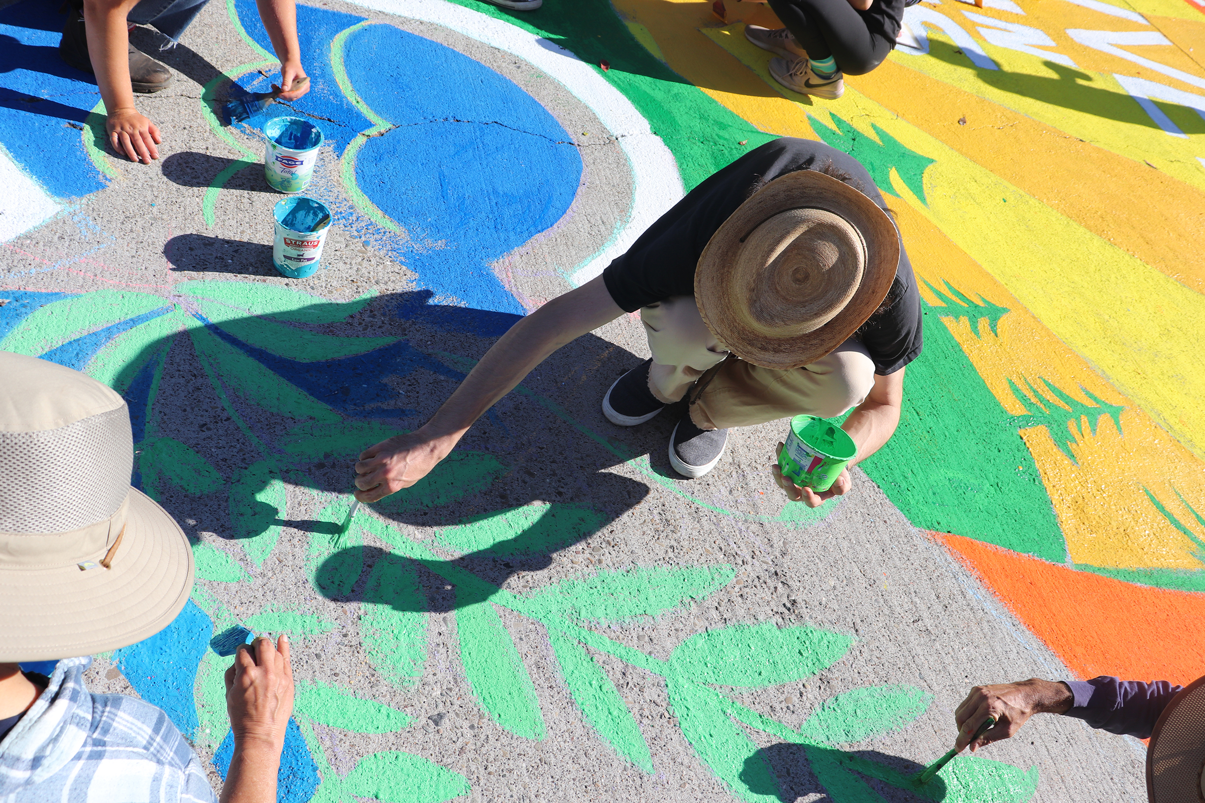 Members of the Sunrise Movement create a mural at a protest outside Nancy Pelosi’s San Francisco home in June 2021.