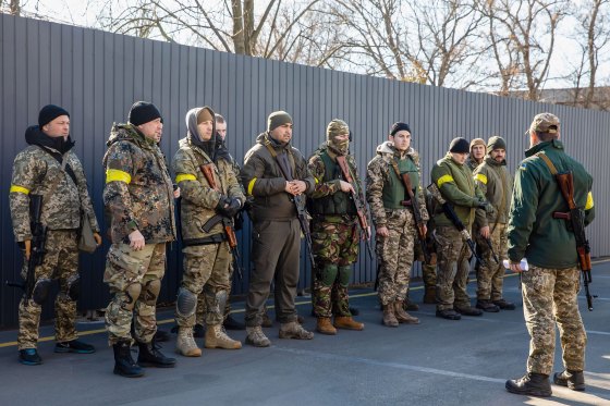 Ukrainian volunteers seen lining up as they report to the Kyiv defense battalion to defend the capital city on March 4, 2022.