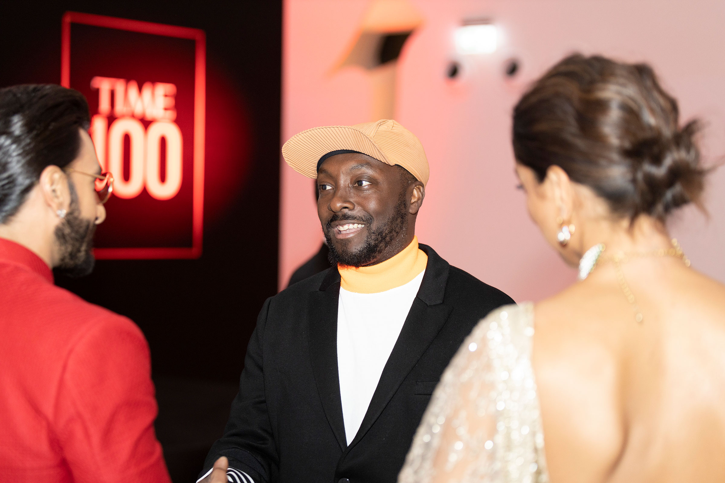 Will.i.am speaks with fellow honoree Deepika Padukone and Ranveer Singh at the TIME 100 Impact Awards and Gala. (Pause Films / Alin Razvan)