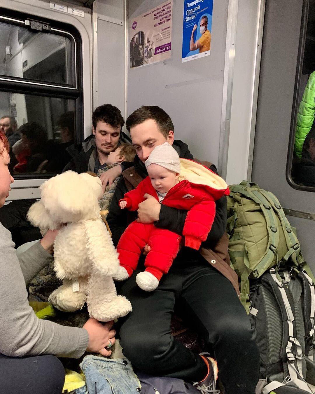 Julia Pavliuk posted this photo of her husband Oleh, holding their daughter Emma on the train to Rivne, Ukraine on March 6 (Courtesy of Julia Pavliuk)