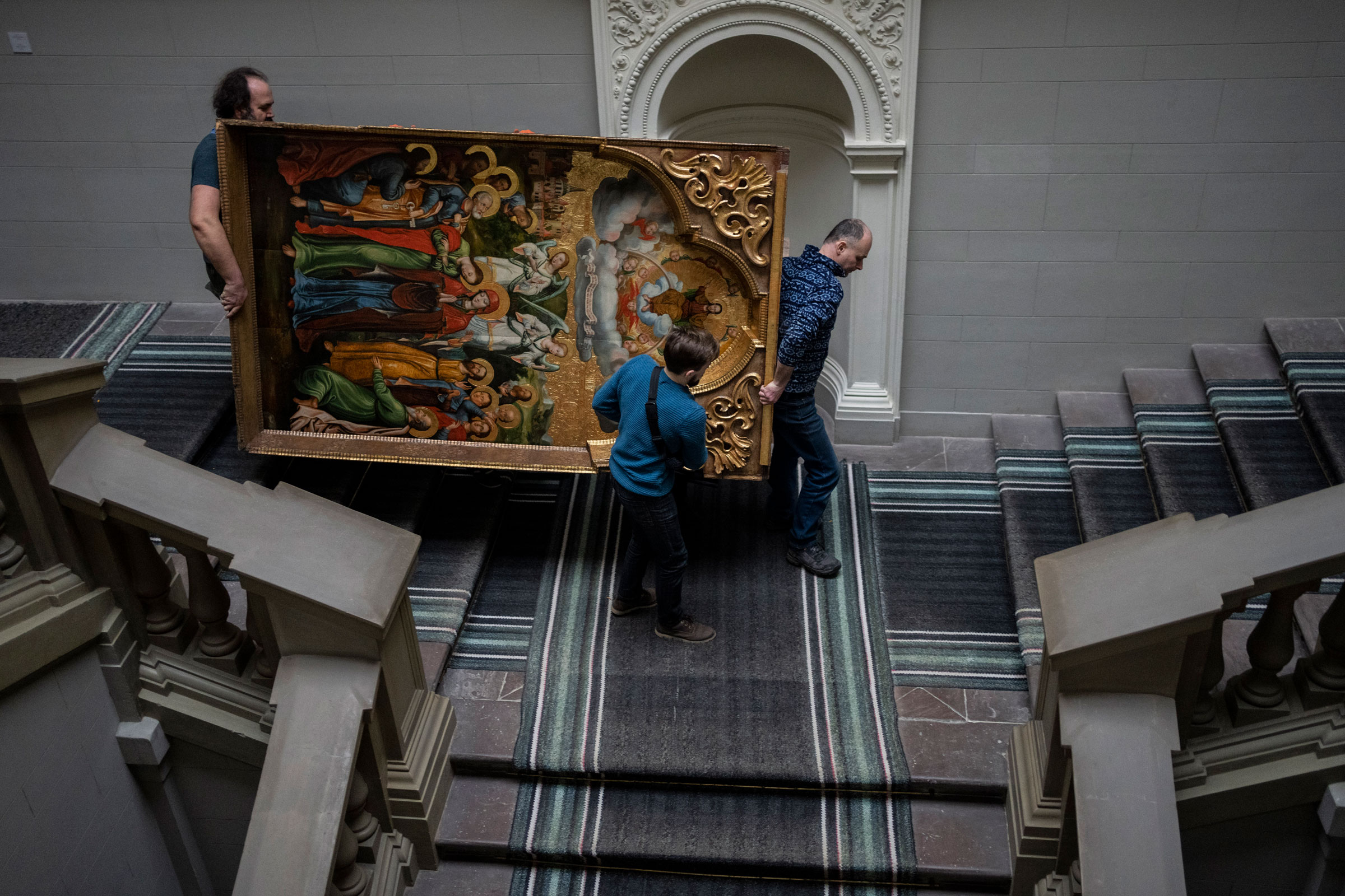 Workers move the Annunciation to the Blessed Virgin of the Bohorodchany Iconostasis in the Andrey Sheptytsky National Museum as part of safety preparations