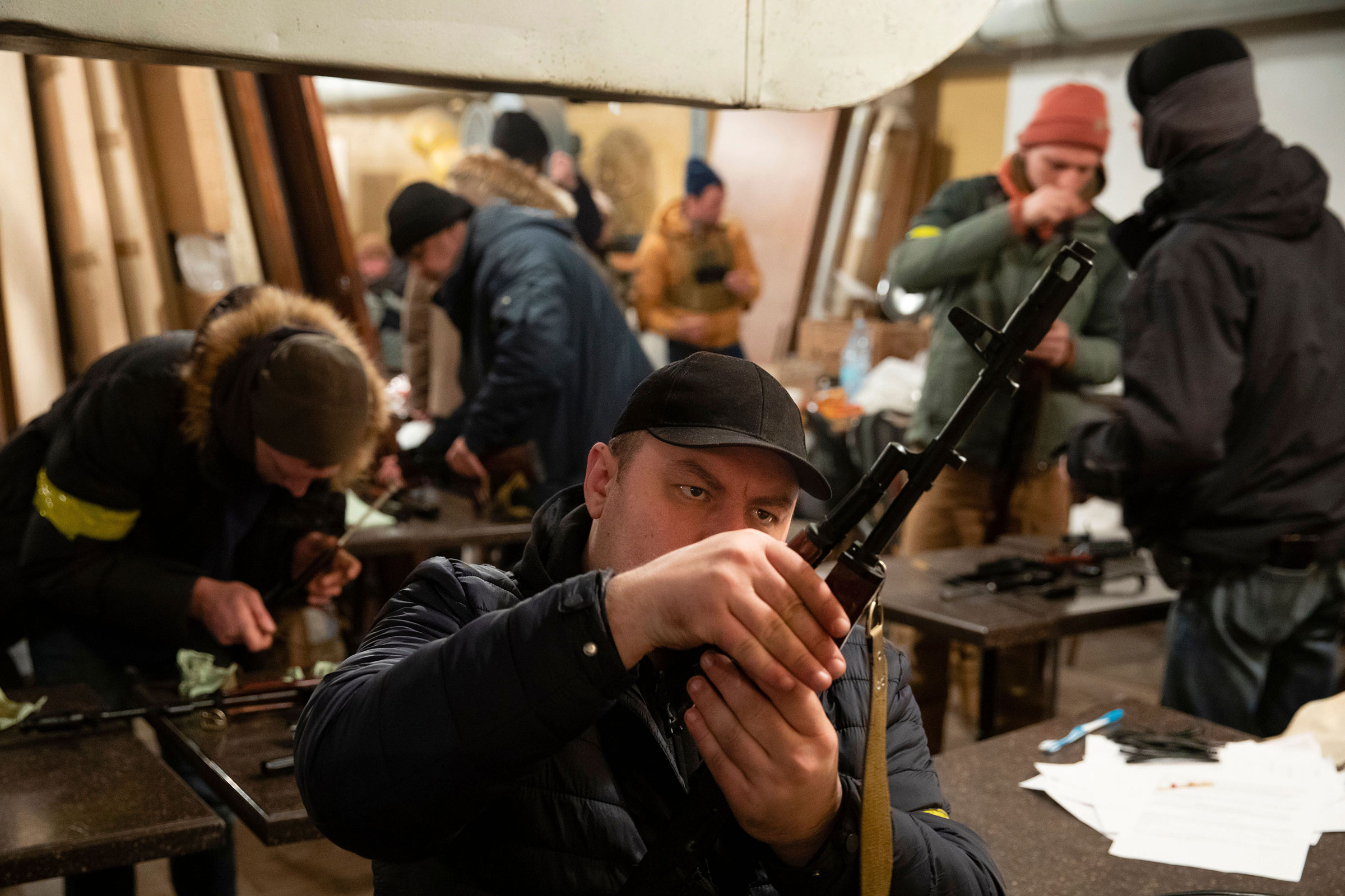 Territorial​ Defense Forces members prepare to patrol in Kyiv on Feb. 28. (Mikhail Palinchak—EPA-EFE/Shutterstock)