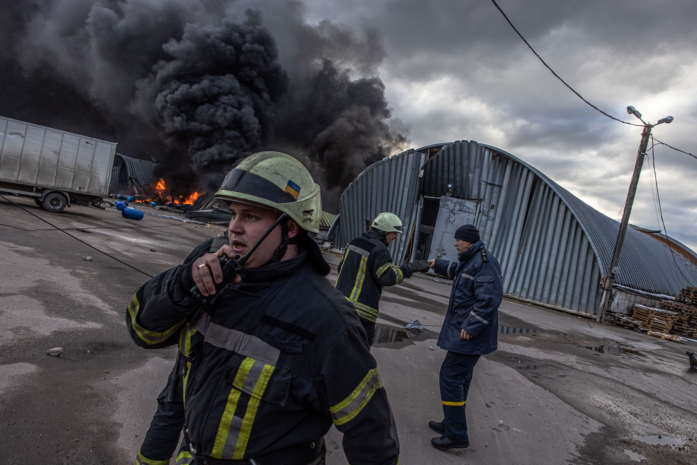 Firefighters try to extinguish a fire at a storage area holding chemicals which was shelled, on the outskirts of Brovary on March 8.