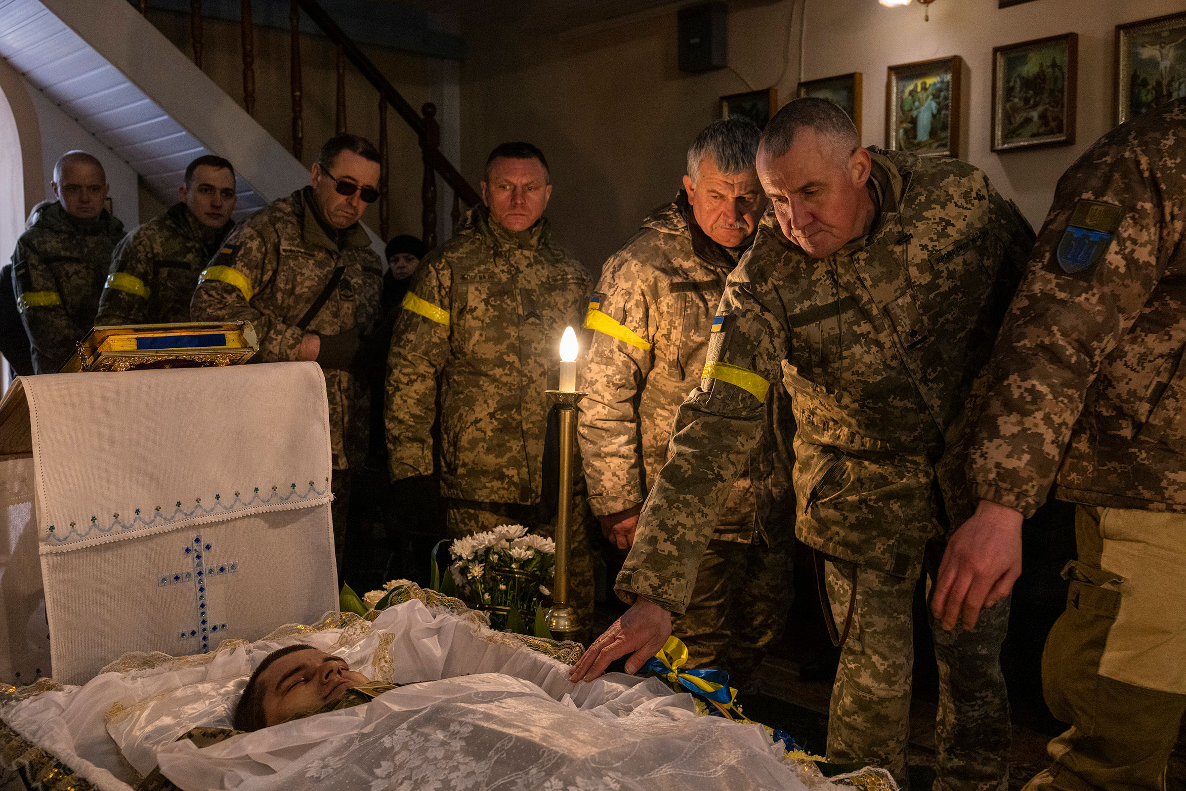Mourners attend the funeral for Senior Sgt. Yevhen Verveyko of the Ukrainian National Army, who was killed while fighting Russian forces, in Yavoriv on March 6.