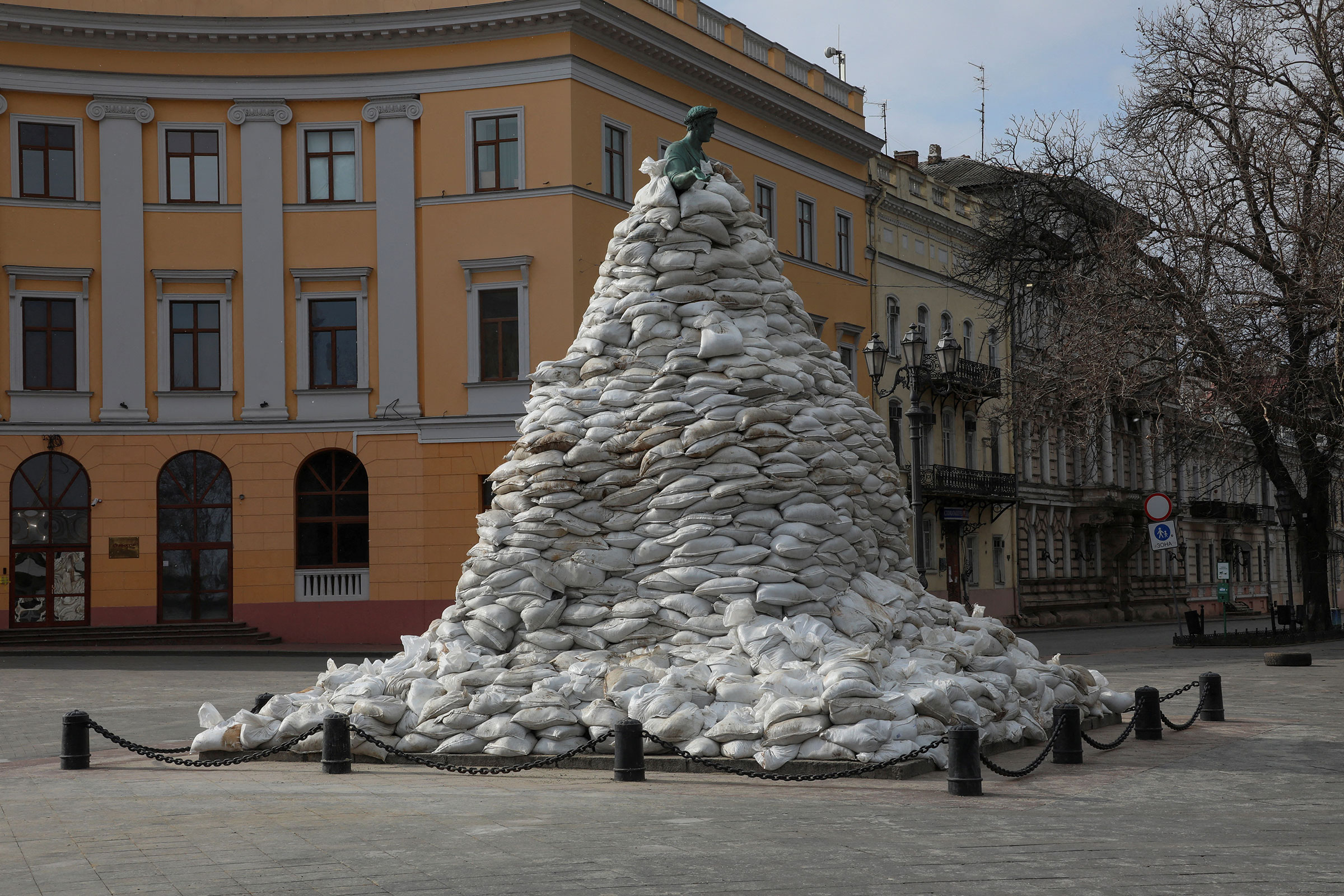 A monument of the city founder Duke de Richelieu is seen covered with sand bags for protection, amid Russia's invasion of Ukraine, in central Odessa on March 9. (Liashonok Nina—Reuters)