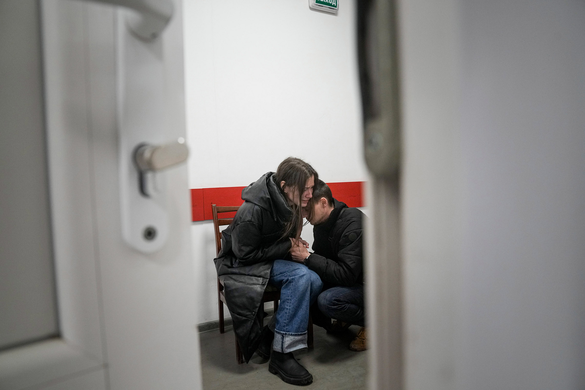 Marina Yatsko and her boyfriend Fedor comfort each other after her 18-month-old son was killed at a hospital in Mariupol, Ukraine, on March 4 (Evgeniy Maloletka—AP)